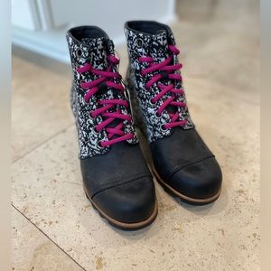 Black with white Sorels. Never been worn. Great for winter and fall.